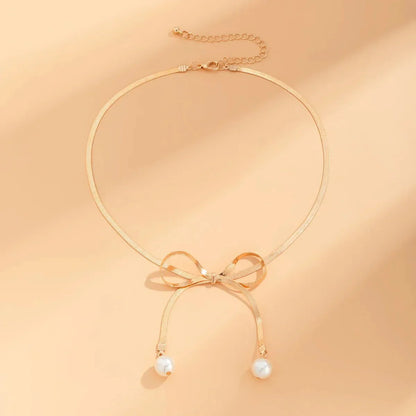 Delicate Patterned Pearl Bow Necklace