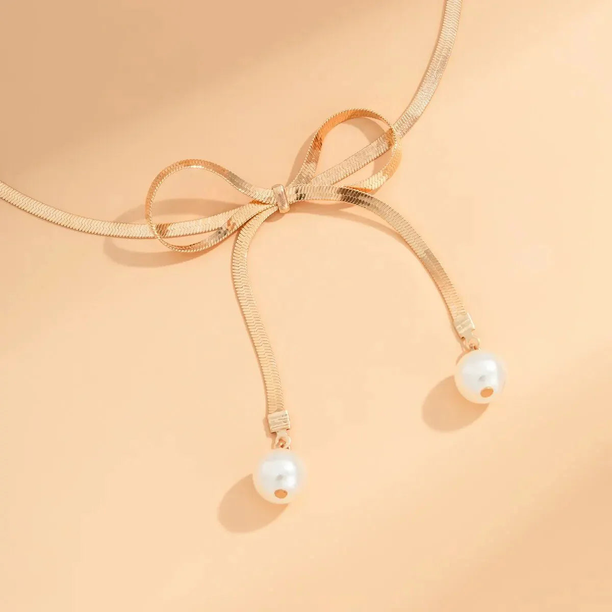 Delicate Patterned Pearl Bow Necklace