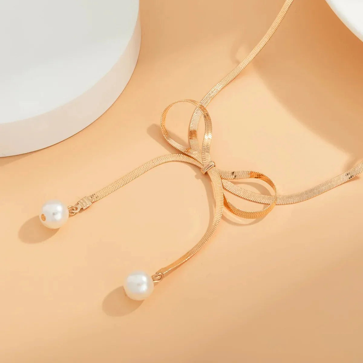 Delicate Patterned Pearl Bow Necklace